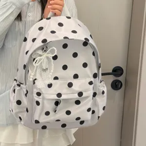 Korean style polka dot lightweight school backpack with cute pearl bow detail for daily use.