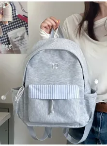 Dettagli dello zaino per studenti coreano, tessuto grigio, tasca a righe blu, borsa casual.