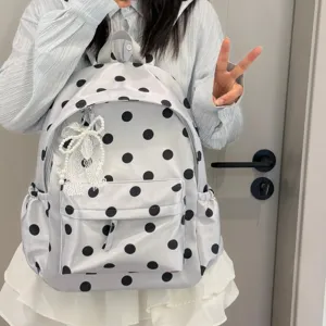 Korean style polka dot backpack detail showcasing cute black dots, soft fabric and lace ribbon.