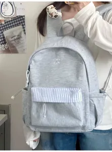 Zaino per studenti casual grigio in stile ins coreano con tasca anteriore a righe.
