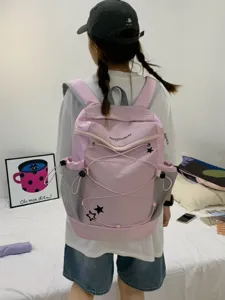Pink Y2K style casual school backpack with drawstring and star pattern details for daily commute.