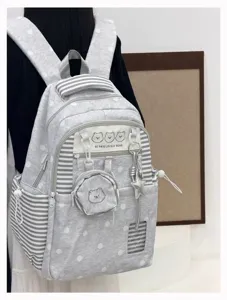 Korean style polka dot backpack detail with cute bear embroidery and star pendant accessory.