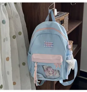 Joli sac à dos ita bleu clair avec fenêtre transparente, nœud brodé et badge animé pour l'école.