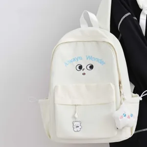 Cute white school backpack detail featuring blue Always Wonder embroidery and soft star plush charm.