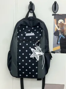Mochila escolar de lunares estilo coreano con bolsillo frontal y colgante de estrella.