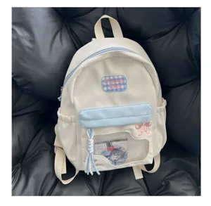 Sac à dos en toile mignon avec fenêtre transparente et nœud, idéal pour les fans d'anime.