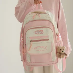 Zaino scolastico rosa in stile giapponese con motivi a stelle e grazioso ciondolo orsetto.