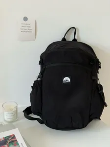 Sac à dos noir multifonctionnel pour les voyages en plein air, grand sac de transport quotidien.