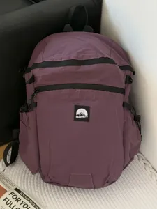 Sac à dos de voyage d'alpinisme léger et imperméable de grande capacité violet loisir