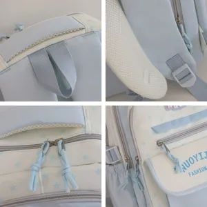 Zaino scolastico azzurro con motivo a stelle per studenti, con tasche multiple e spallacci.
