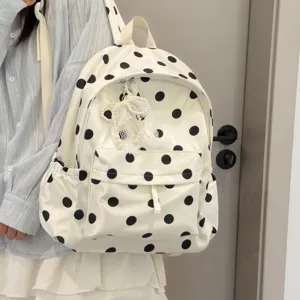 Cute Korean style polka dot backpack for school girls, lightweight and stylish daily bag.