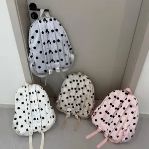 Detail view of Korean style polka dot lightweight school backpack, cute student bookbag.