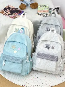 Vue détaillée de sacs à dos coréens mignons en toile avec patchs étoiles, grande capacité.