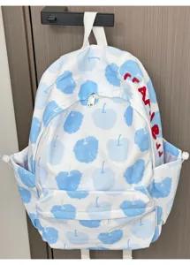 Vista dettagliata dello zaino in tela con stampa di frutta blu, tasca laterale e bel design.