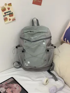 Y2K aesthetic grey backpack with star patches and multi pockets for daily commute school