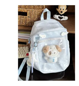 Light blue polka dot transparent ita backpack with cute plush doll pocket and angel wings detail.
