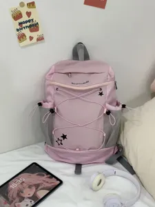 Pink aesthetic student casual backpack with mesh side pockets and cute star print details