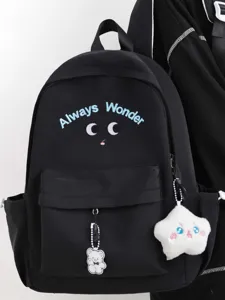 Black school backpack for women, cute canvas travel daypack with embroidery and charms.