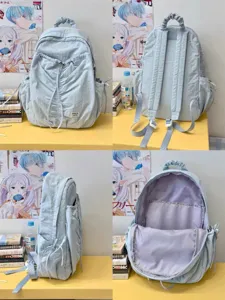 Detailed view of the light blue pleated backpack showing front, back, side and inner capacity.