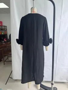 Back view of black linen midi dress with 3D floral sleeves, elegant and chic detail.