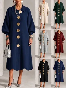 Detail view of knitted maxi dress with big metal buttons, lapel collar and long sleeves for winter.