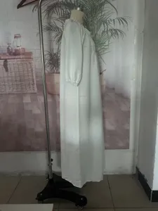 White long sleeve V-neck bohemian maxi dress casual resort wear for women summer daily use.
