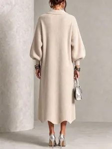 Detailed view of women's beige knit midi dress featuring long sleeves and chic collar.
