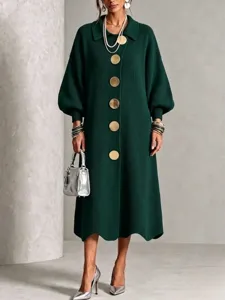 Close up detail view of a dark green knit dress with large gold buttons for women.