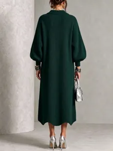 Back detail view of a dark green knitted maxi dress, long sleeves and elegant style.