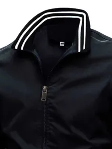 Detail shot of men black jacket collar with double white stripes and metal zipper closure.