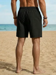 Pantalón corto de playa negro hombre vista detallada, ropa de verano holgada cordón.