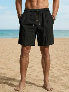 Pantalones cortos de playa de lino casual para hombre en negro con cordón y botones frontales.
