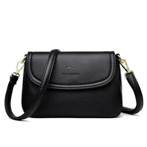 Schwarze Leder Umhaengetasche fuer Damen, klassische Schultertasche mit goldener Hardware.