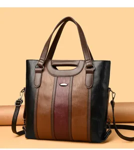 Color-block handbag detail view, premium PU leather tote bag texture and hardware.