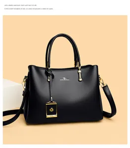 Elegante schwarze Handtasche aus Leder mit goldenen Beschlägen und klassischem Design.
