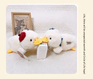Cute white plush duck stuffed animal toy with red hat, soft healing companion gift display.