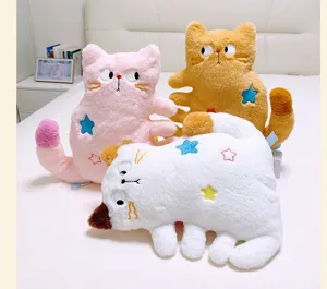 Detailed shot of cute multi-legged cat plush pillow with star embroidery on soft bed setup.