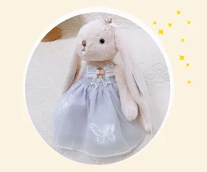 Plush lop-eared rabbit detail, purple princess dress with butterfly embroidery, soft toy.