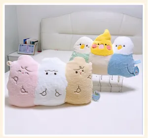 Close-up detail of cute cartoon animal plush pillows and bird dolls arranged nicely on the bed.