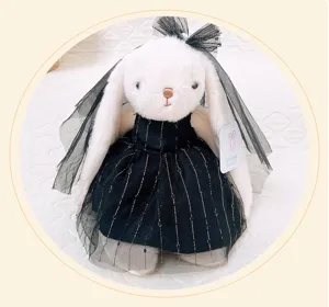 Adorable lop-ear rabbit plush toy wearing an elegant black wedding dress and veil.