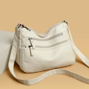 Soft leather multi-pocket shoulder bag for women, stylish large capacity crossbody mom bag.