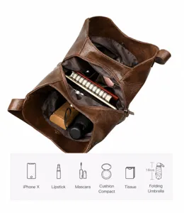 Binnenkant detail van de bruine lederen shopper met grote capaciteit en vakken.