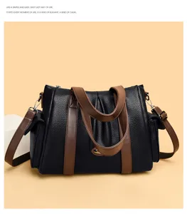 Detailed view of women's leather shoulder tote bag, stylish contrast design for daily commuting.