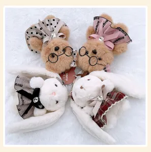 Cute plush bear and bunny doll keychains with stylish dresses and ribbons for bags.