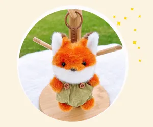 Cute fluffy orange fox plush toy keychain with green overalls charming bag charm gift.