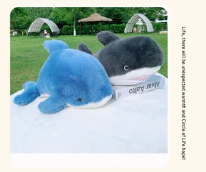 Detailed view of cute plush shark toys in outdoor garden setting, soft and cozy toys.