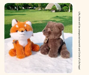 Detailed view of cute plush toys, soft brown bear and orange fox sitting nicely on a fluffy mat.