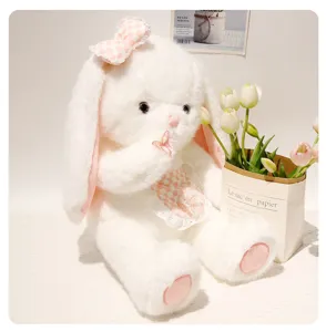 Cute white rabbit plush toy doll with pink bow and bib, soft stuffed animal gift for girls.