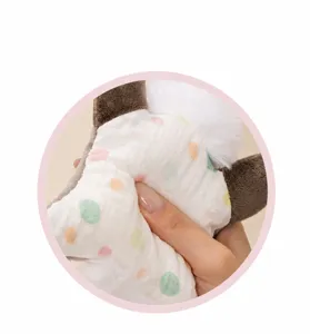 Cute plush animal beanbag toy detail shot, soft polka dot fabric, stress relief pillow.