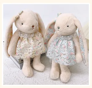 Detailed view of cute lop-eared bunny plush toy with lace floral dress, soft doll pendant.